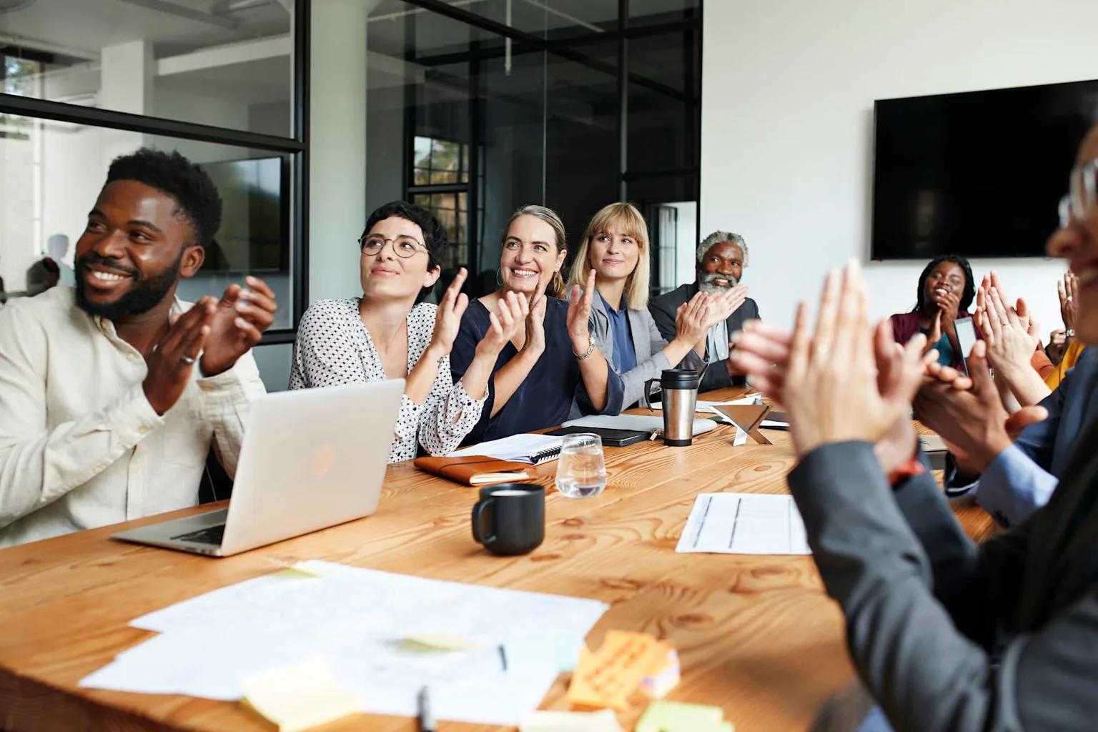 A team celebrating a win, representing the cultural shift to AI-first collaboration